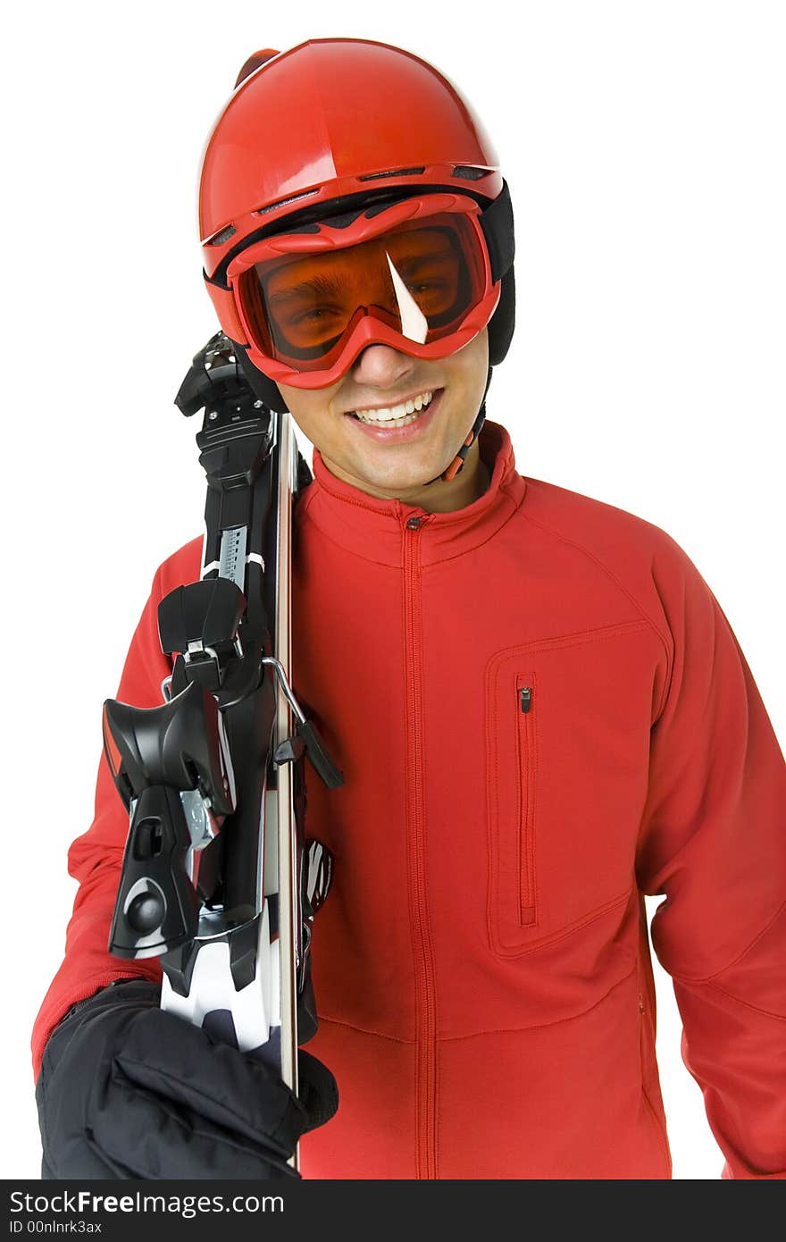 Smiling skier dressed ski overall. He holding on shoulder skis. He's on white background. Smiling skier dressed ski overall. He holding on shoulder skis. He's on white background