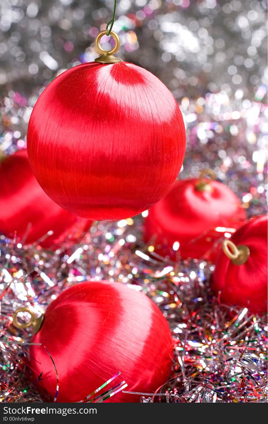 Red Christmas ornaments with multicolored glitter. Red Christmas ornaments with multicolored glitter