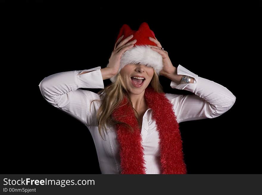 Girl in a Santa hat and boa having fun