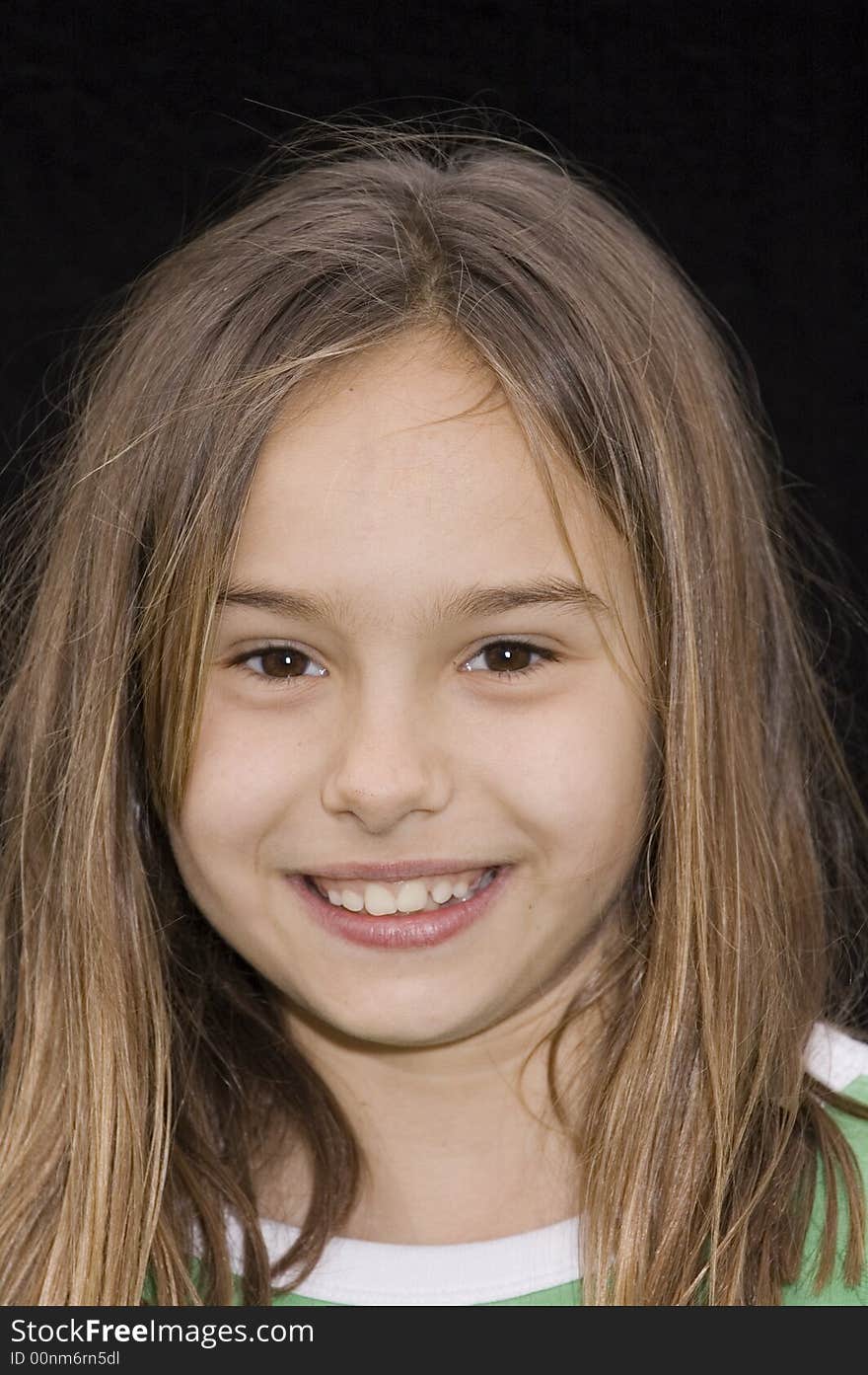 Cute smiling caucasian american girl with wind blown hair. Cute smiling caucasian american girl with wind blown hair