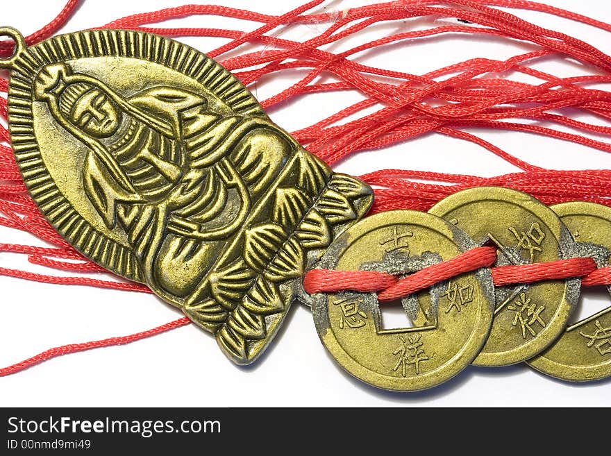 Chinese Buddha with old coins and red lace in white background. Chinese Buddha with old coins and red lace in white background