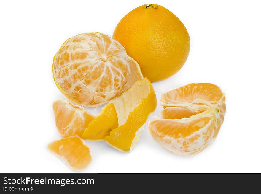 Still life of solid and peeled tangerines in white background. Still life of solid and peeled tangerines in white background