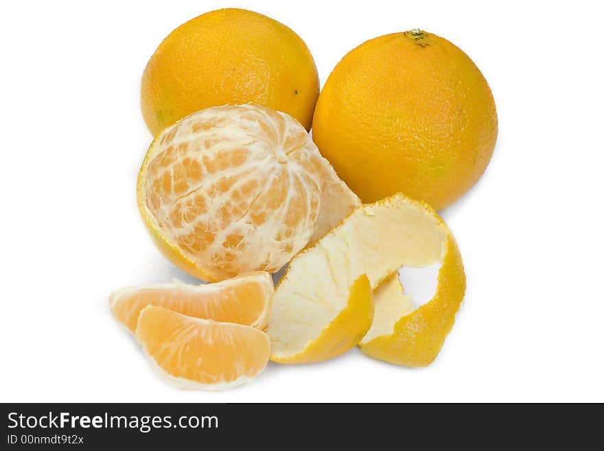 Still life of two solid ,half-peeled and cut in segments tangerines in white background. Still life of two solid ,half-peeled and cut in segments tangerines in white background