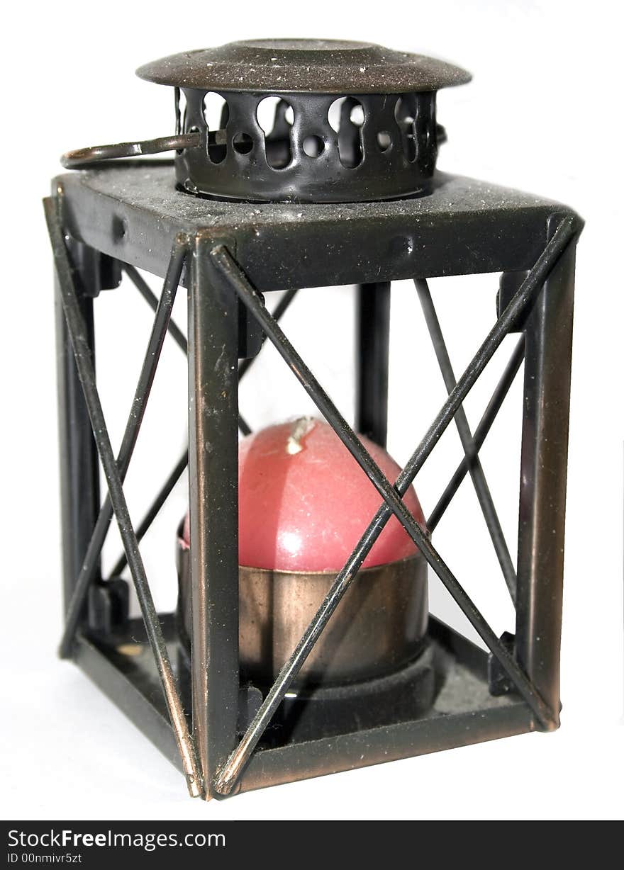 Old lamp with red candle and white background