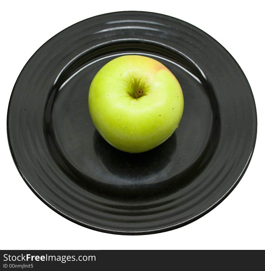 Close-up of fresh apple on a black plate