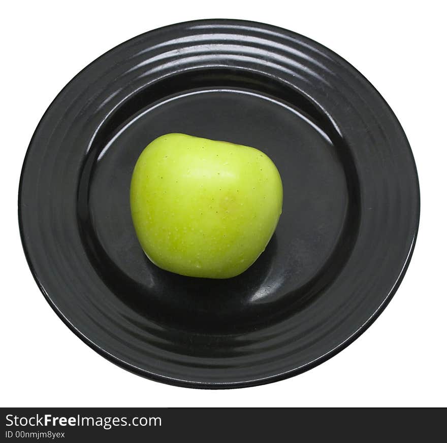 Close-up of fresh apple on a black plate