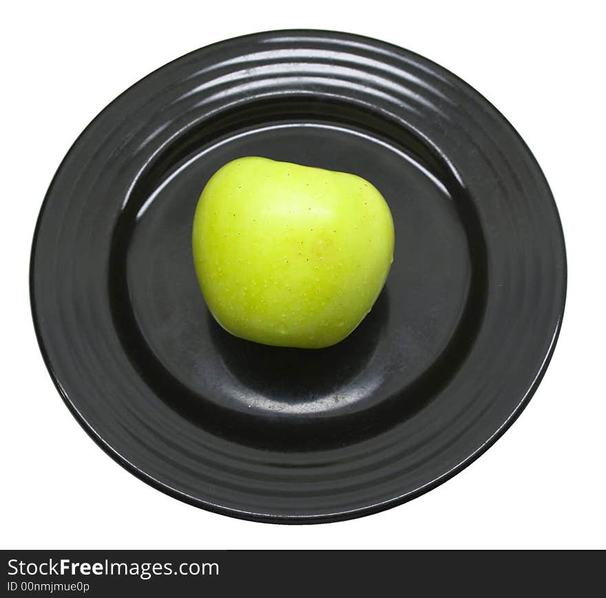 Close-up of fresh apple on a black plate