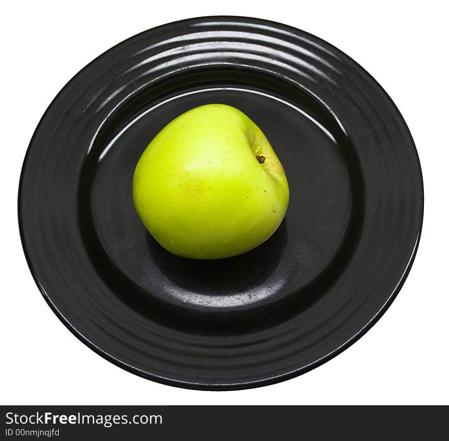 Close-up of fresh apple on a black plate