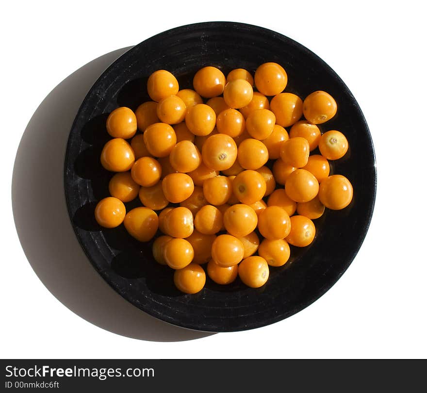 Close-up of black plate with cape gooseberries. Close-up of black plate with cape gooseberries