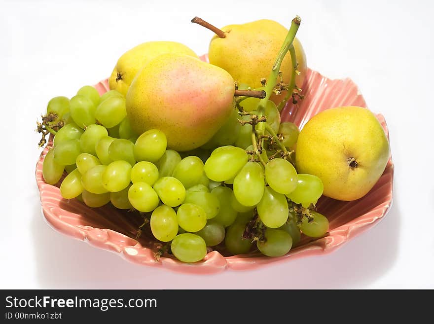 Pears and grapes in pink vase