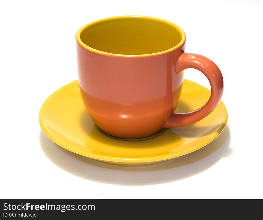 Glazed pottery coffee cup and saucer with white background. Glazed pottery coffee cup and saucer with white background