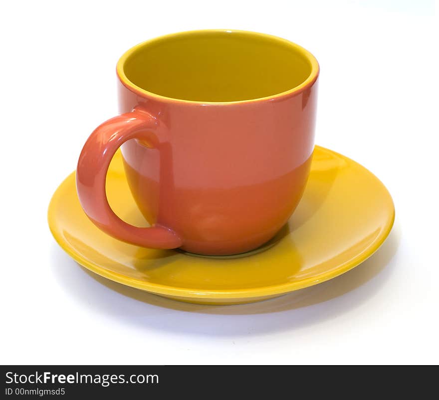 Glazed pottery coffee cup and saucer with white background. Glazed pottery coffee cup and saucer with white background