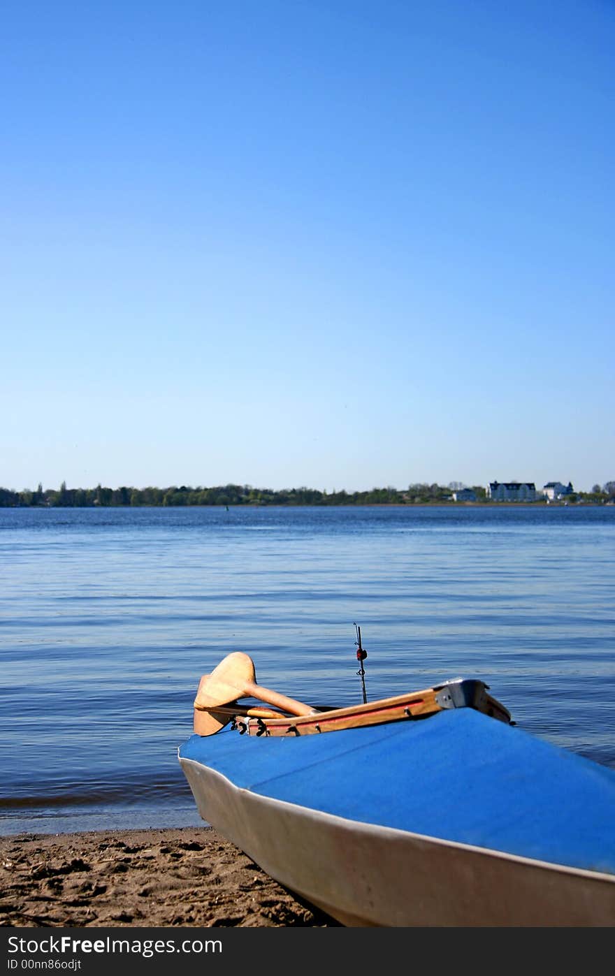 Blue Canoe On The Shore