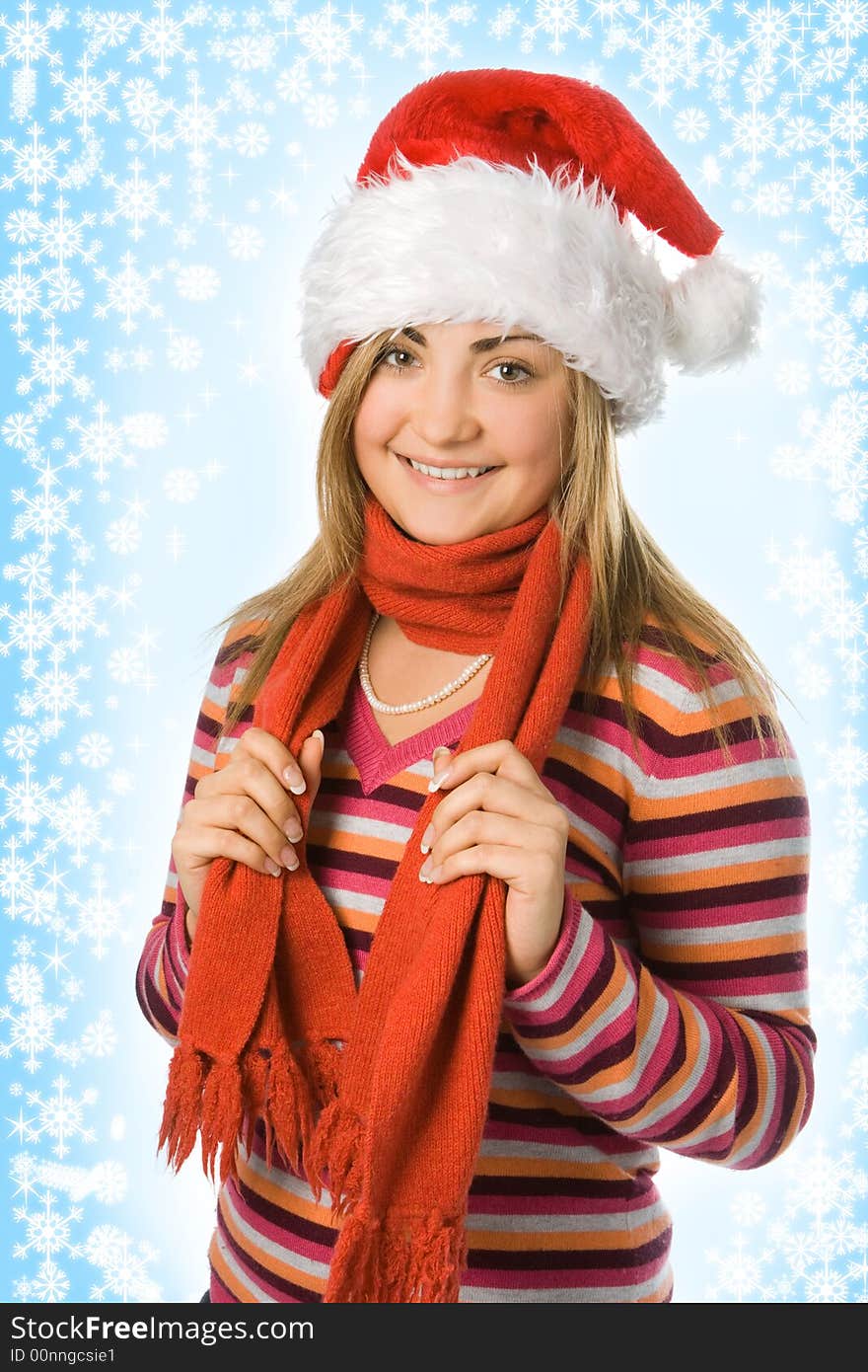 Christmas girl in red hat and scarf and snowflake and starlet