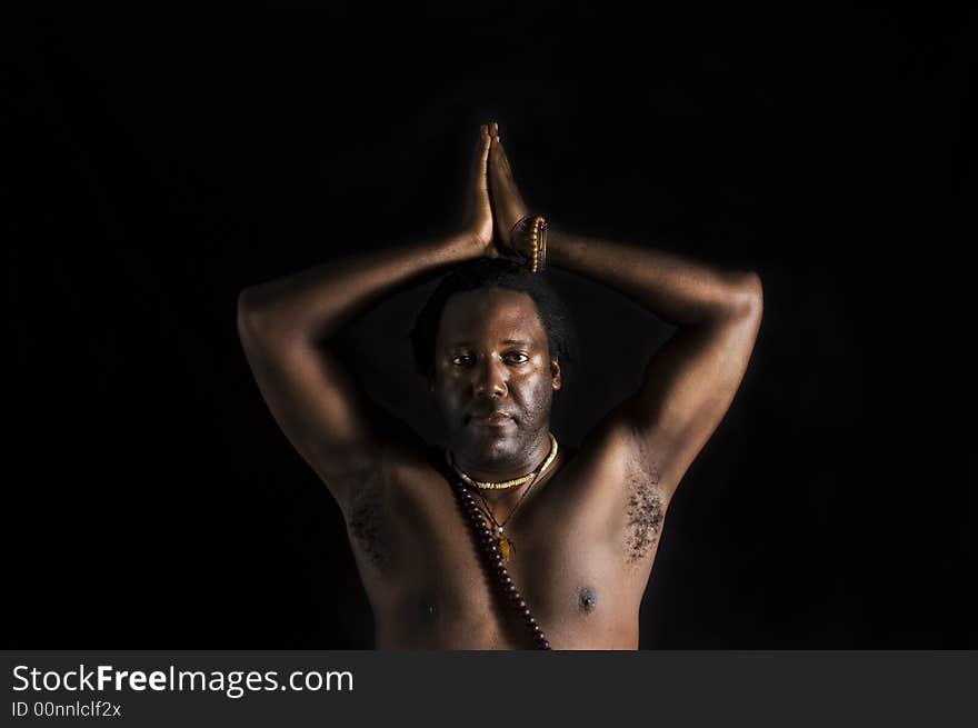 Yogi - Portrait of afroamerican man doing yoga - isolated on black