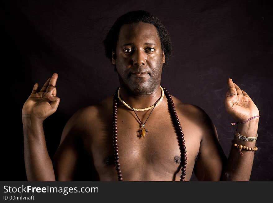 Yogi - Portrait of afroamerican man doing yoga - isolated on black