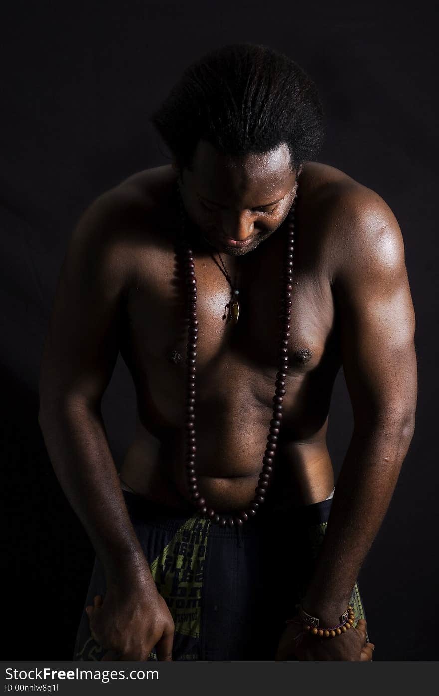 Portrait of afroamerican man doing yoga - isolated on black. Portrait of afroamerican man doing yoga - isolated on black