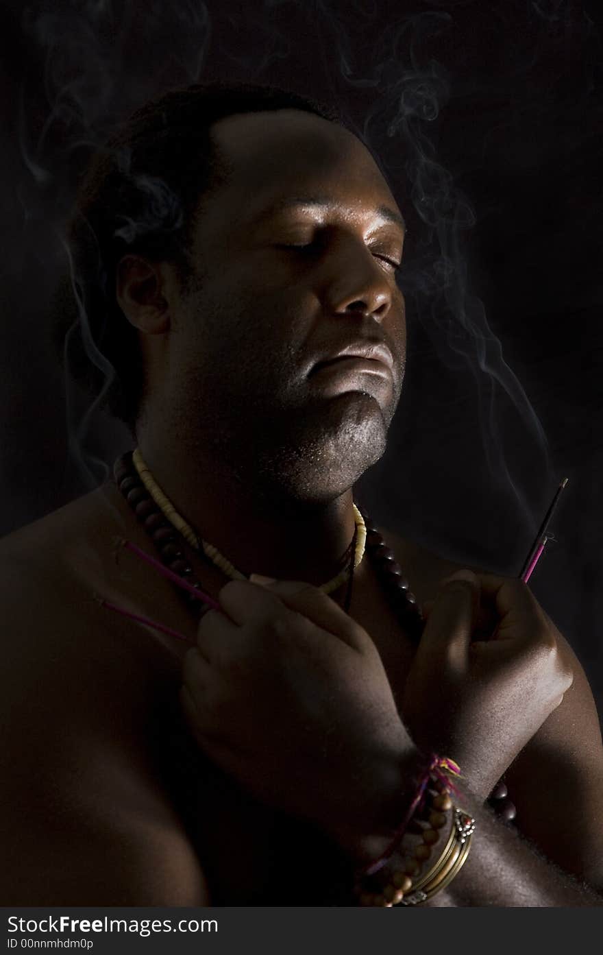 Portrait of afroamerican man in meditation - isolated on black