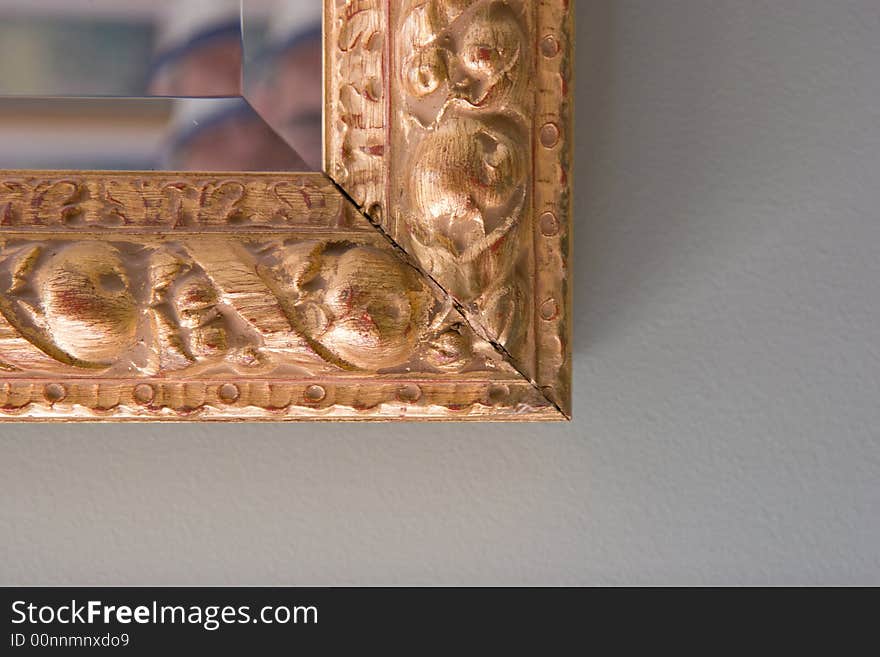 Gilt edged frame of a mirror