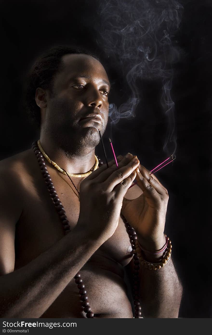 Portrait of afroamerican man in meditation - isolated on black. Portrait of afroamerican man in meditation - isolated on black