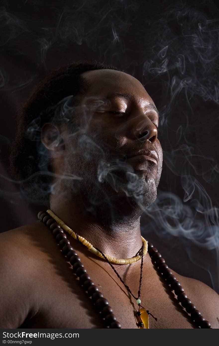 Portrait of afroamerican man in meditation - isolated on black