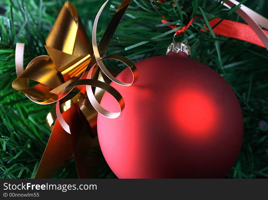 Red ball hanging from christmas tree