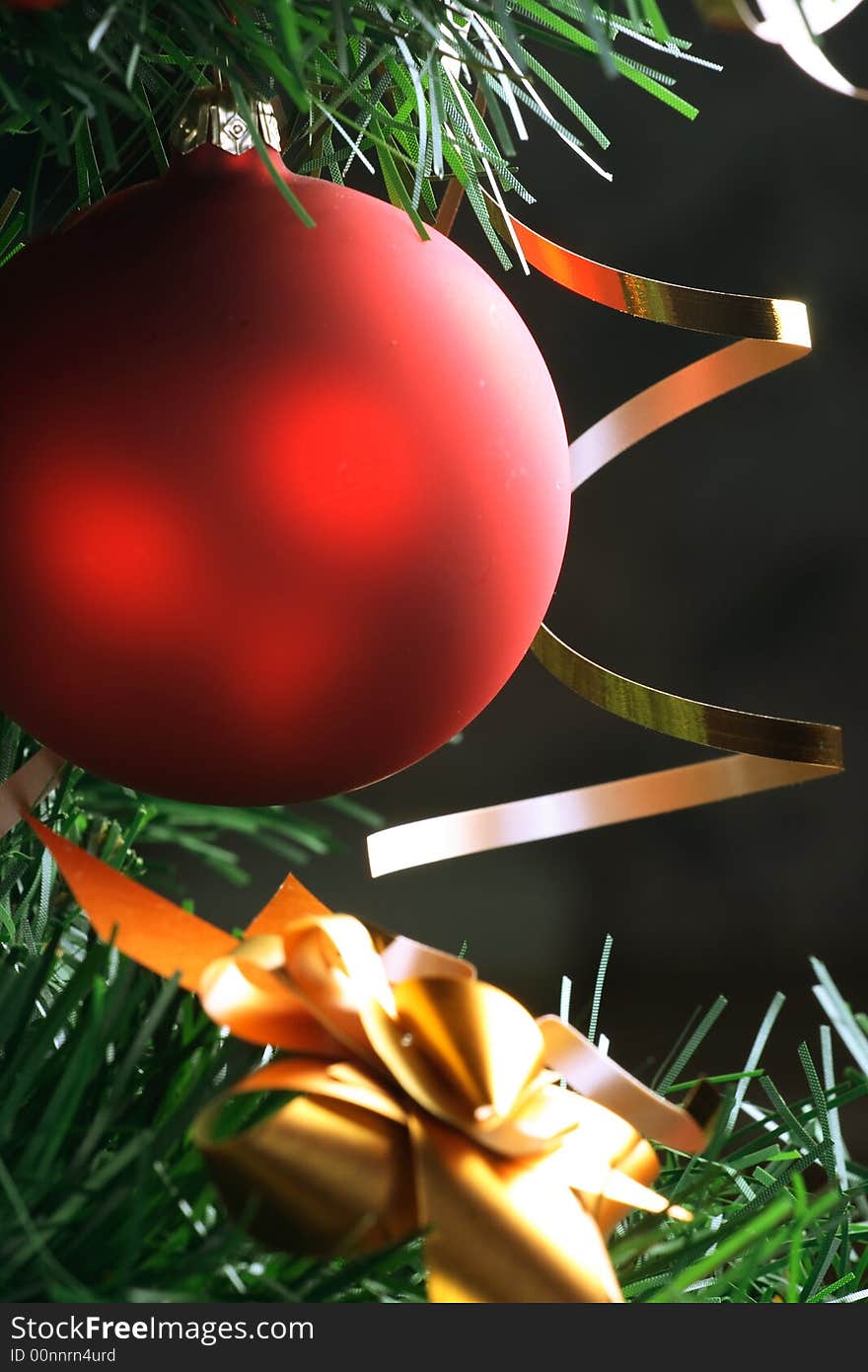 Red ball hanging from christmas tree