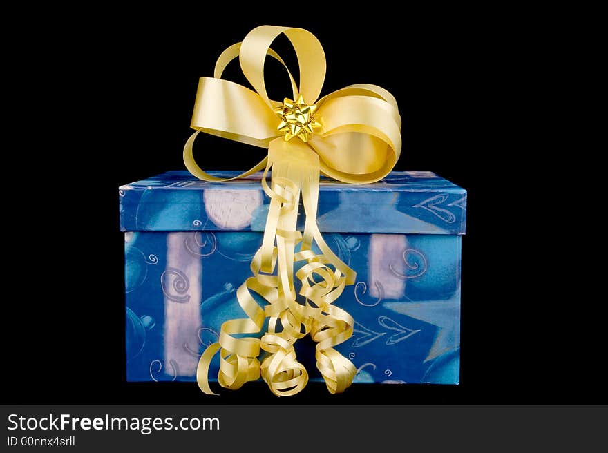 Box, bow and ribbon on black background