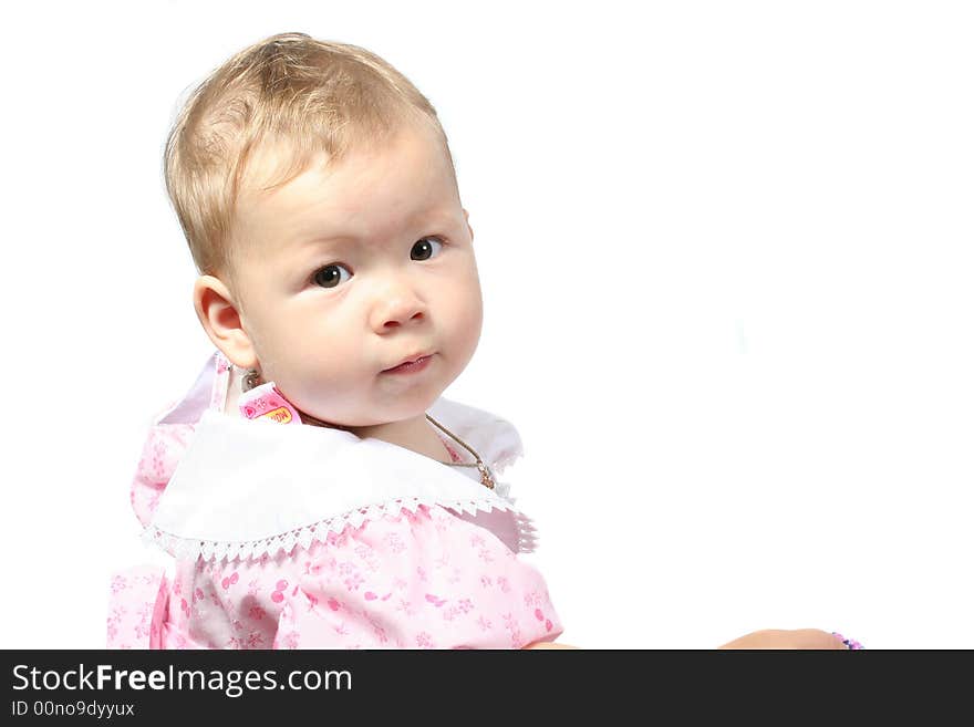 The small child looks in a camera on a white background