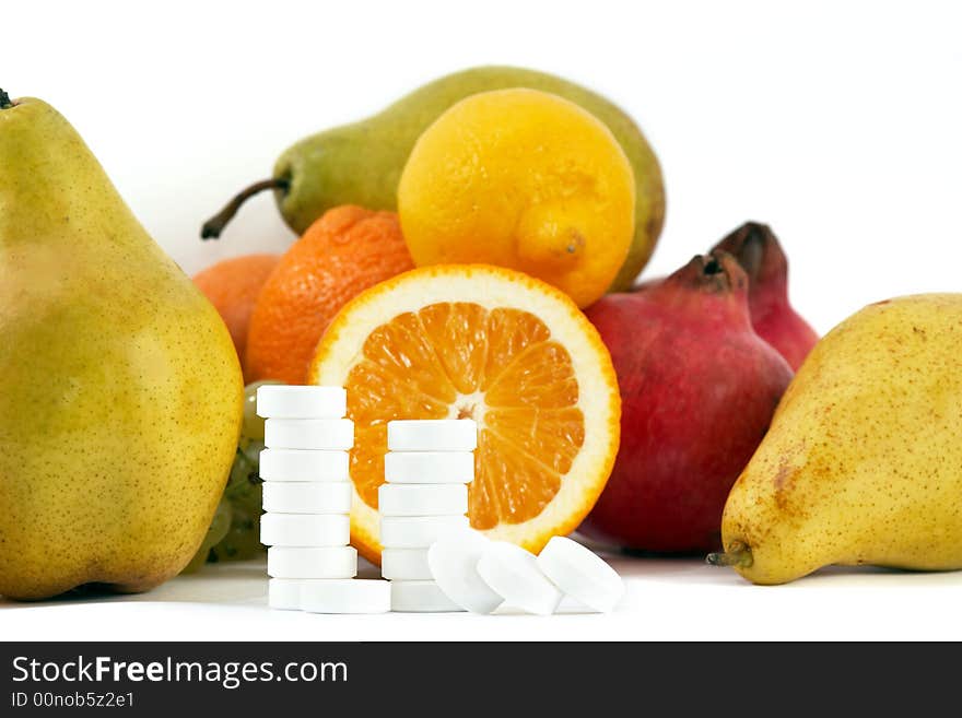 An image of fruit and pills. An image of fruit and pills