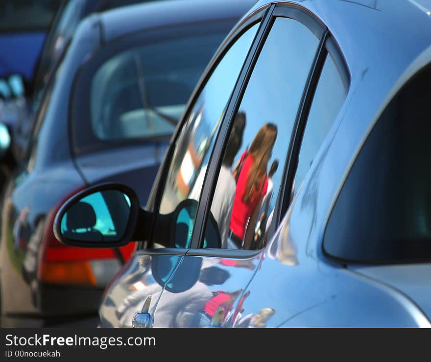 Reflections Of People On Cars