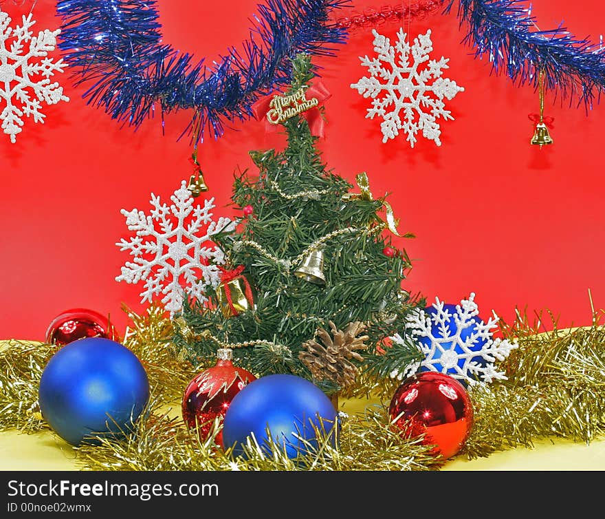 New year's embellishment under artificial fir tree. New year's embellishment under artificial fir tree