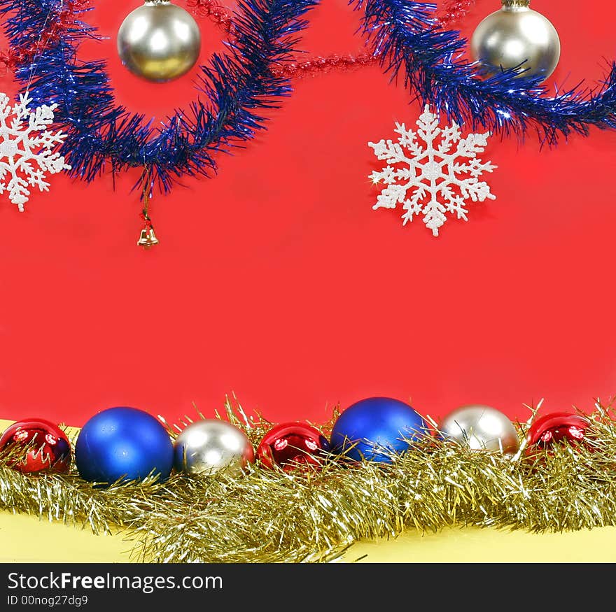 Christmas decoration: varicoloured balls and white snowflakes.