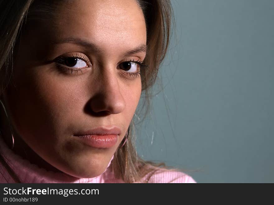 Close-up portrait of young beautiful girl on grey-green. Close-up portrait of young beautiful girl on grey-green