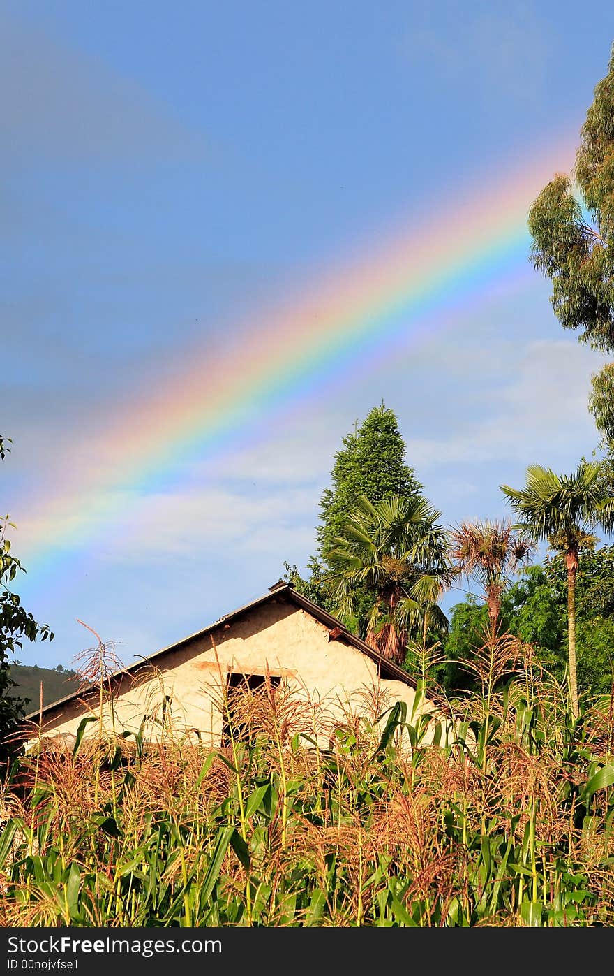 Rainbow over a small hani village