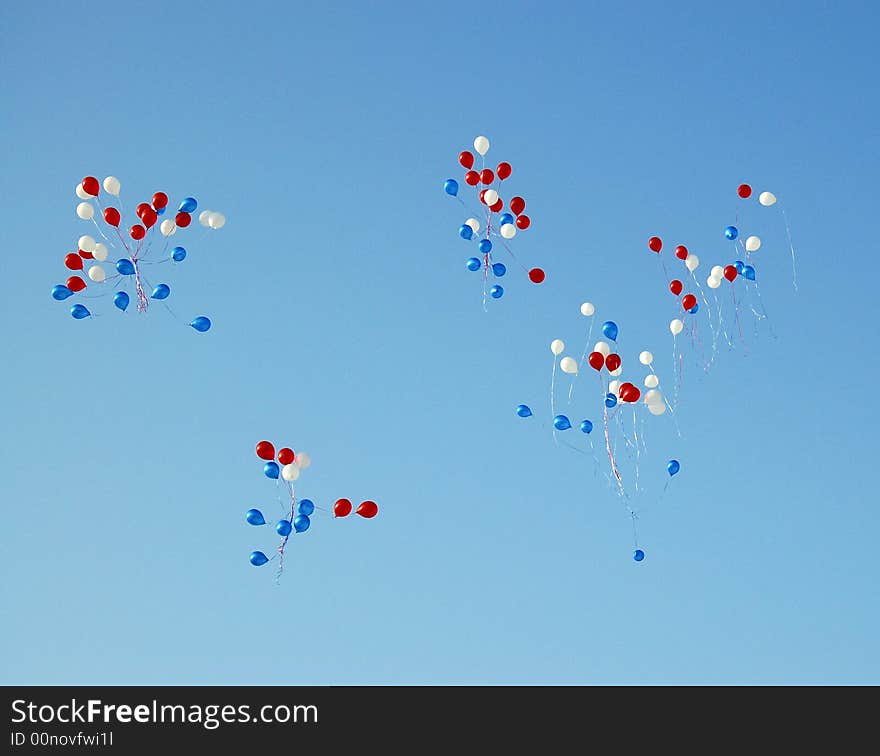 Red, white, dark blue balloons in the pure blue sky. Red, white, dark blue balloons in the pure blue sky