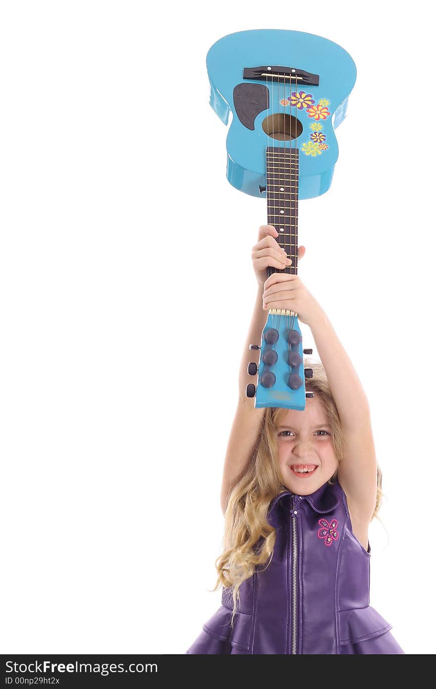 Photo of a rockstar child smashing her guitar straight