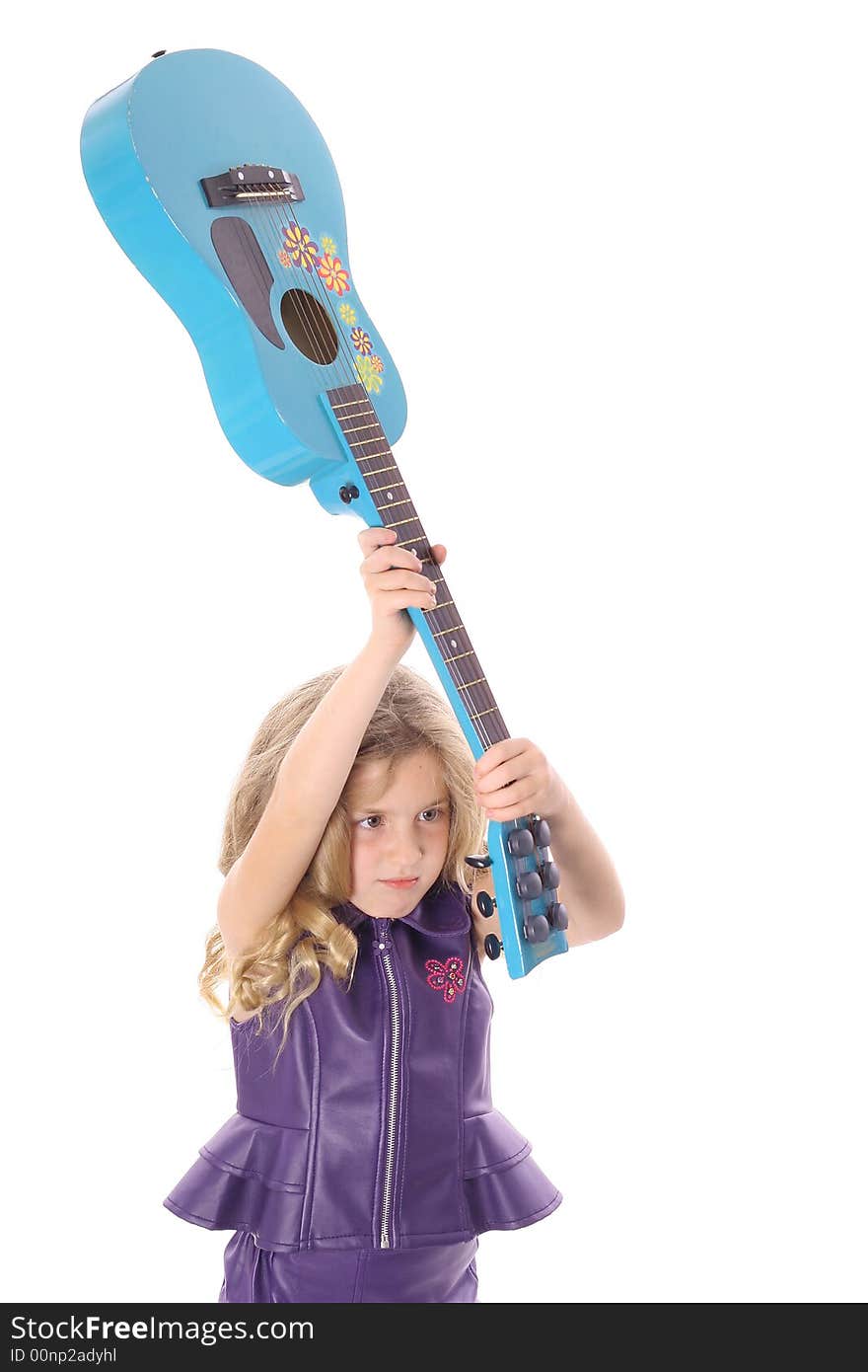 Shot of a rockstar child smashing her guitar