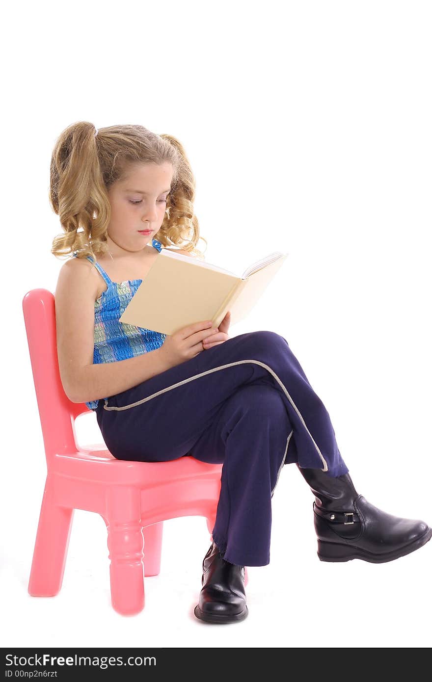 Photo of a little girl reading