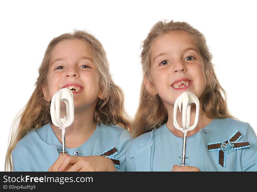 Shot of children begging to lick beaters