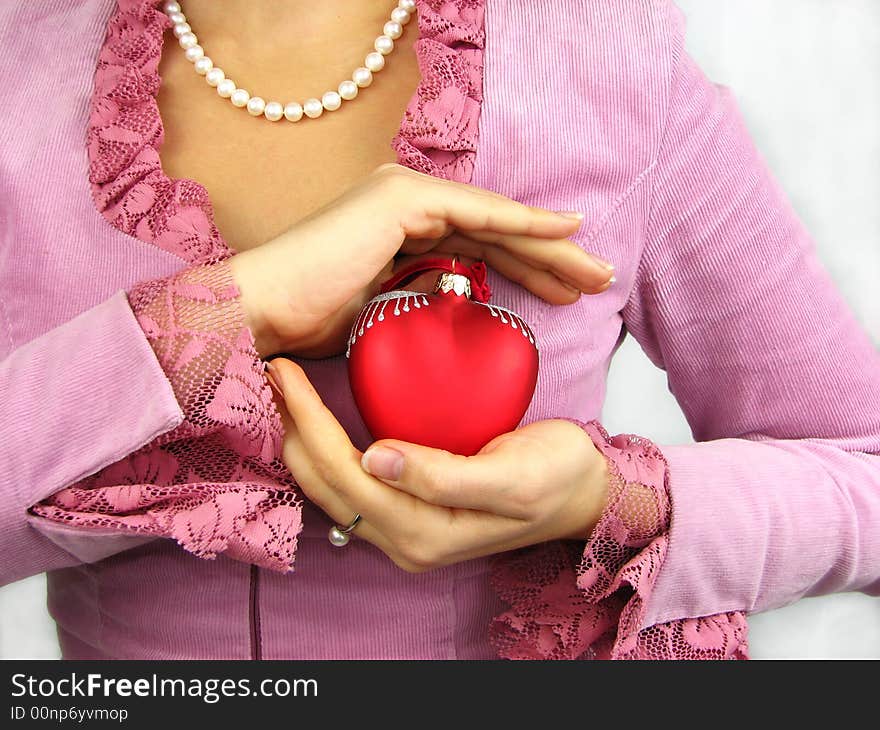 Woman and red heart in hand. Woman and red heart in hand