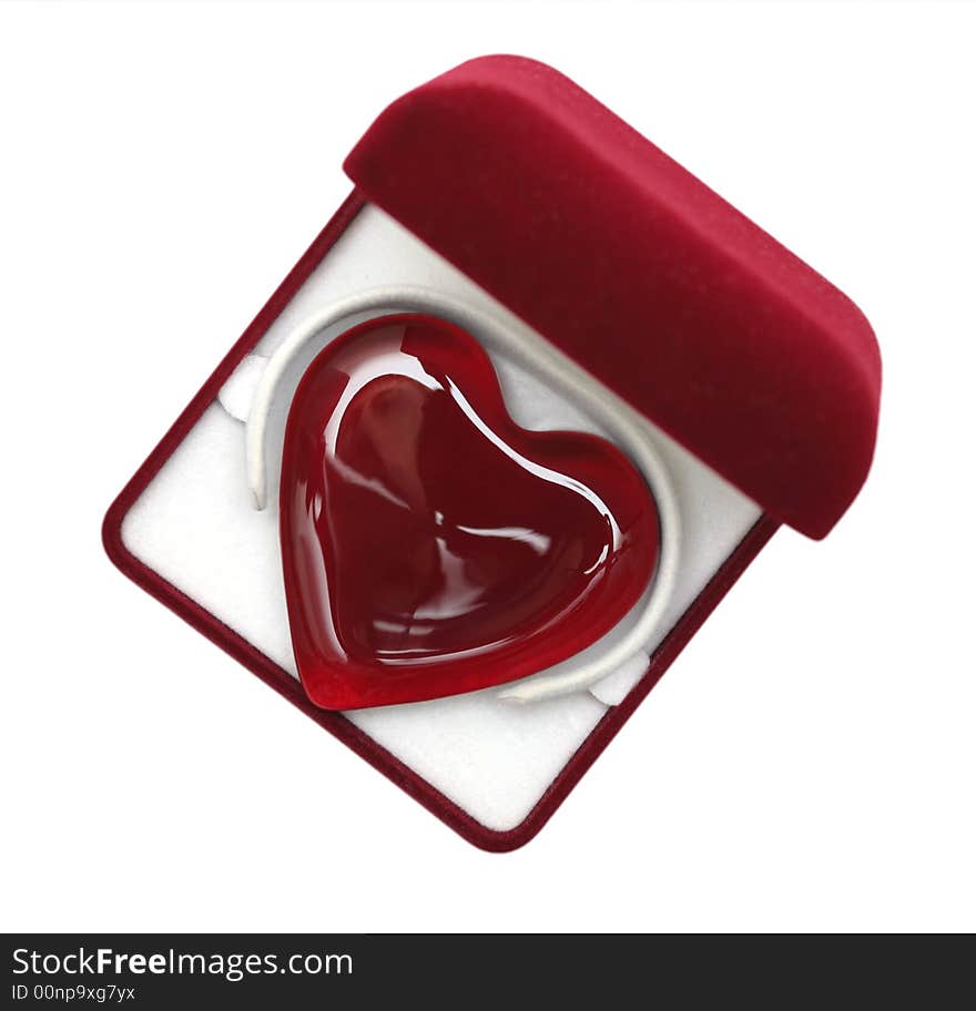 A glassy purple heart in a box against white background. A glassy purple heart in a box against white background