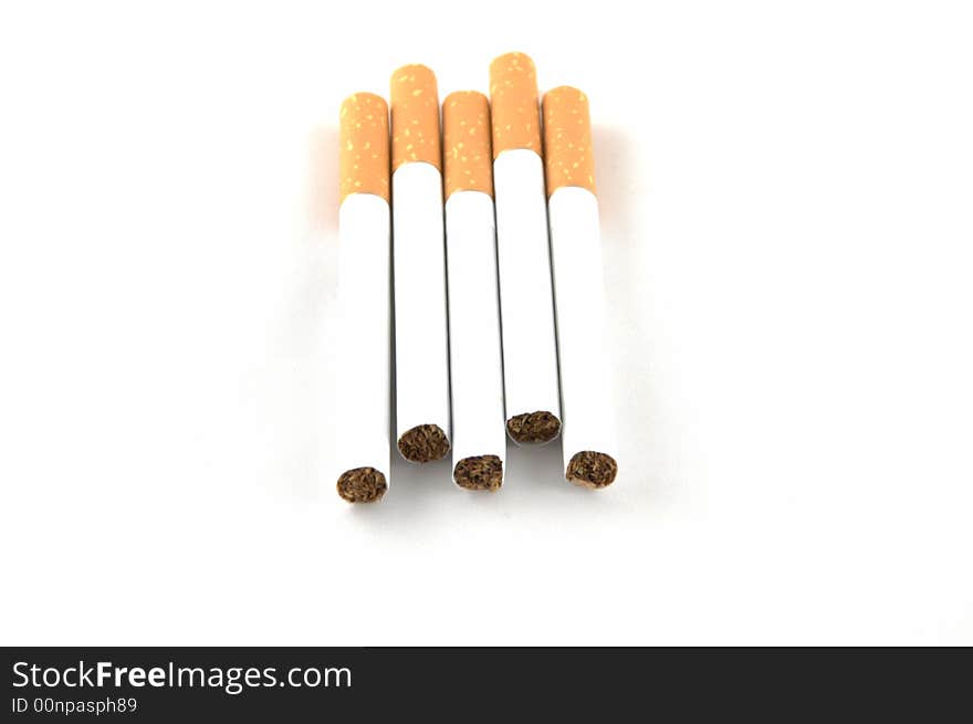 Cigarettes laying on a white background