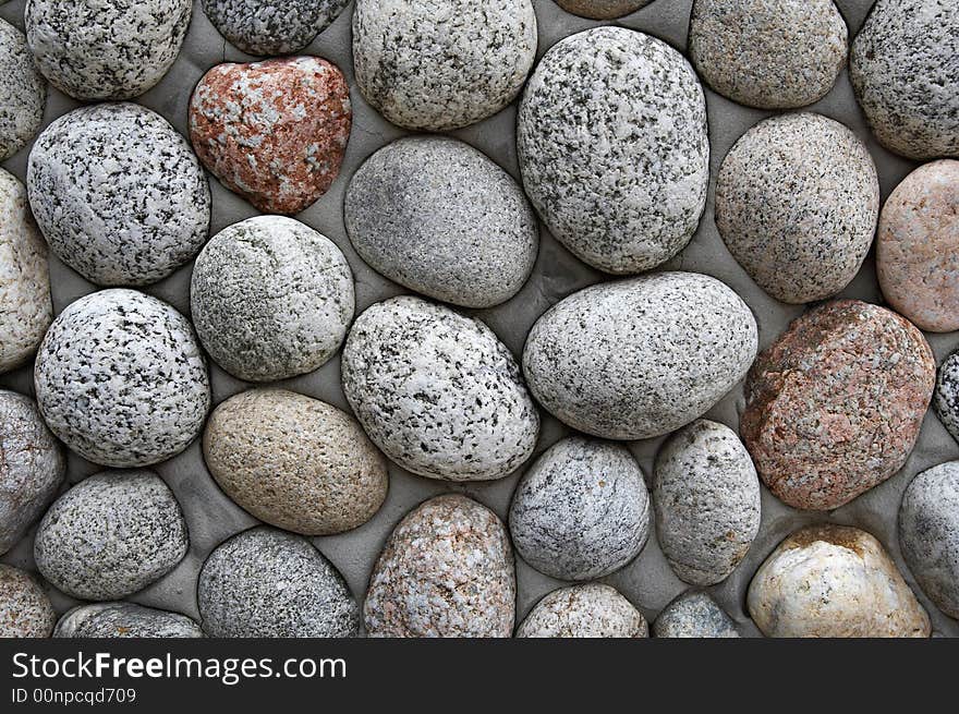 Close up of grey round pebbles