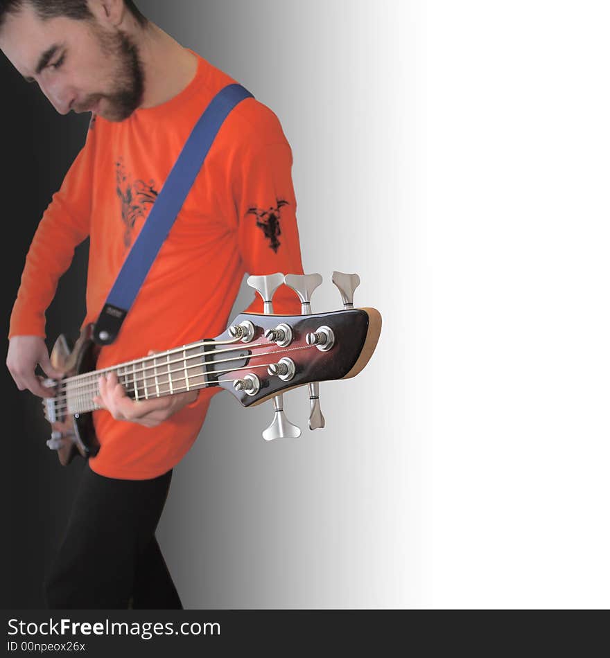 Musician is member of rock group play on the bass guitar