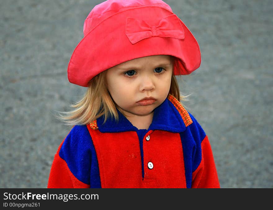 Portrait of the girl in a red hat