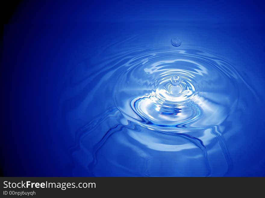 Real water drops in blue. Real water drops in blue