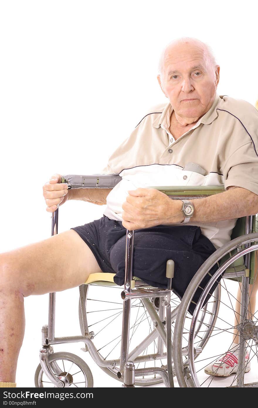 Eldery man in wheelchair vertical isolated on a white background