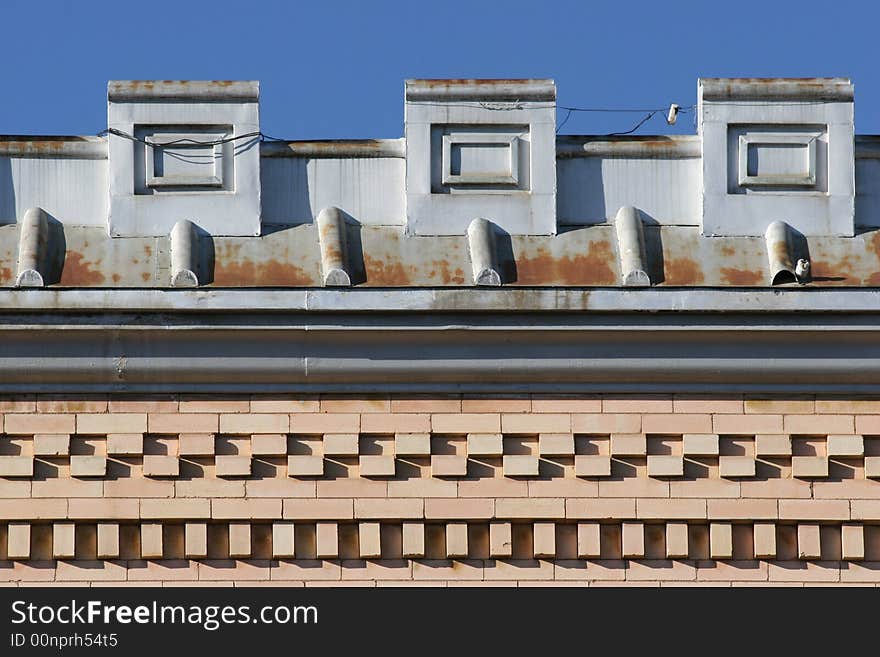 Old building rooftop and brickwork with blue sky background. Old west town. Colorado, USA. Old building rooftop and brickwork with blue sky background. Old west town. Colorado, USA