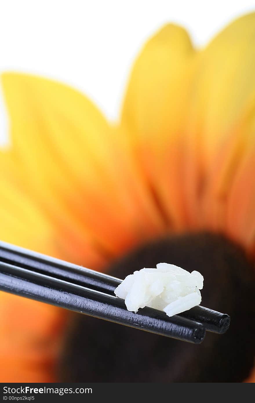 Chopsticks and rice against colorfull background